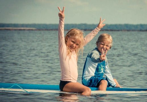 brother and sister surfers